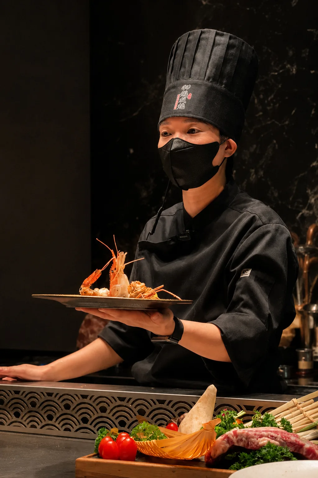 A THE GU chef presenting an Omakase course