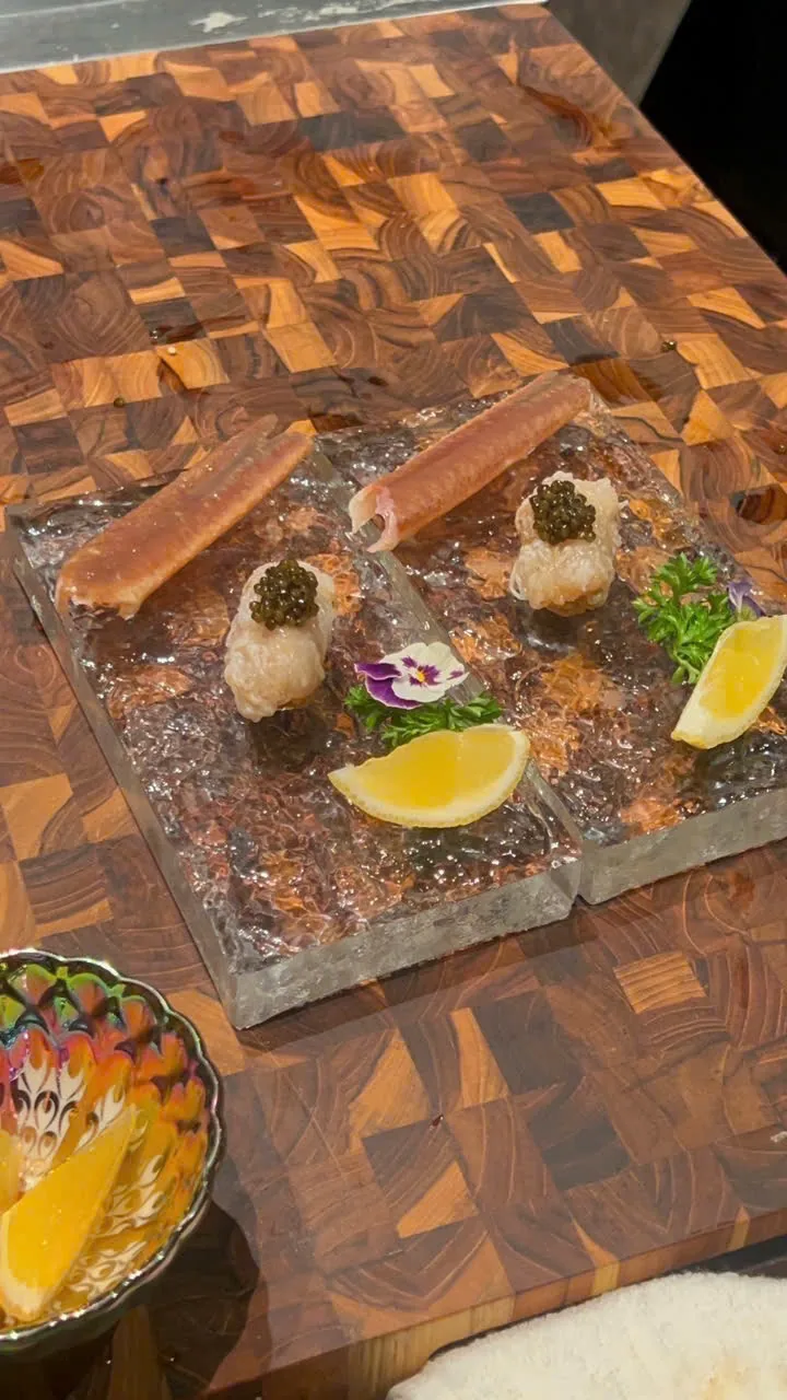 A finished crab and roe course at the counter