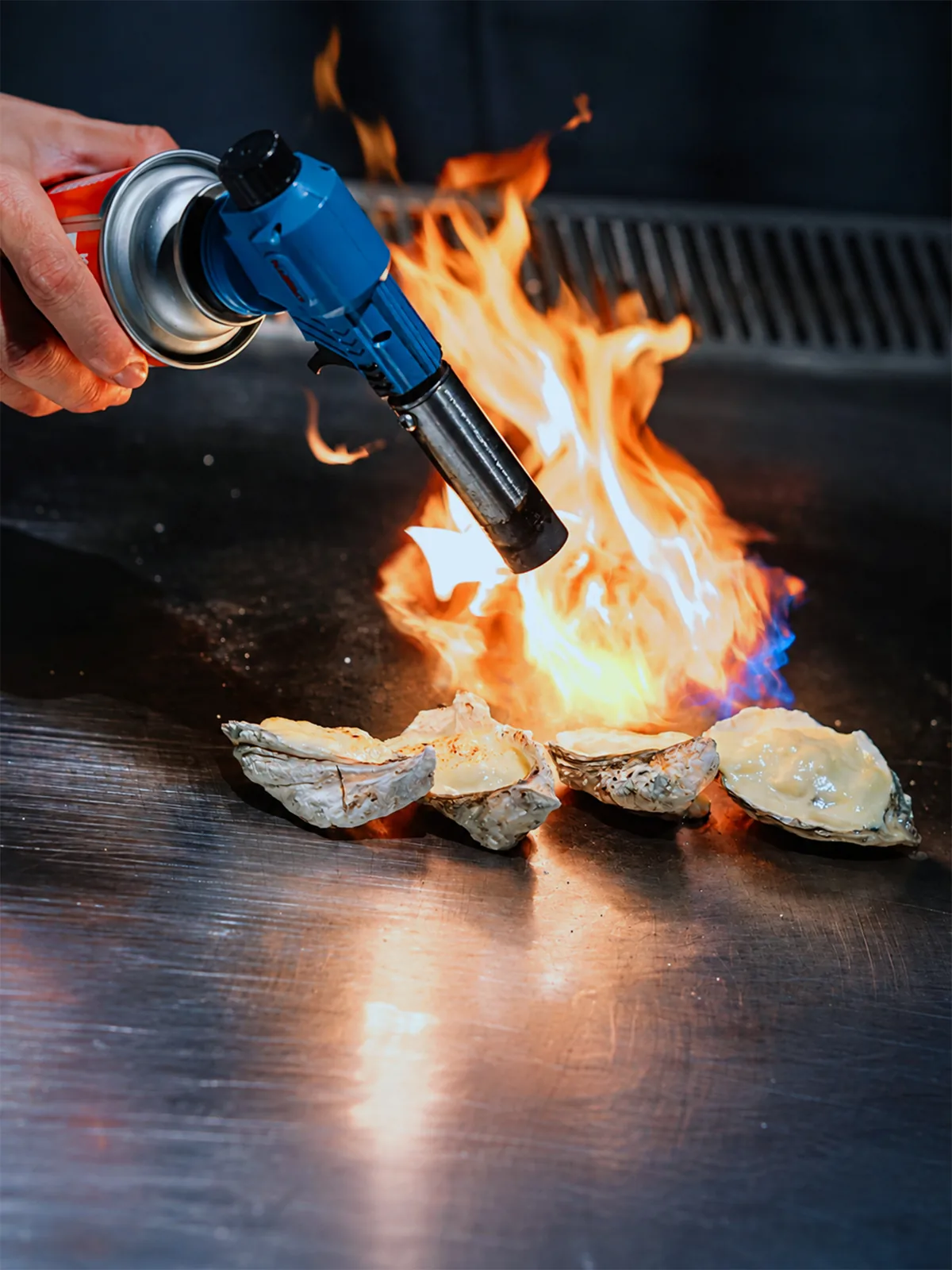 Shellfish cooked with flame at THE GU